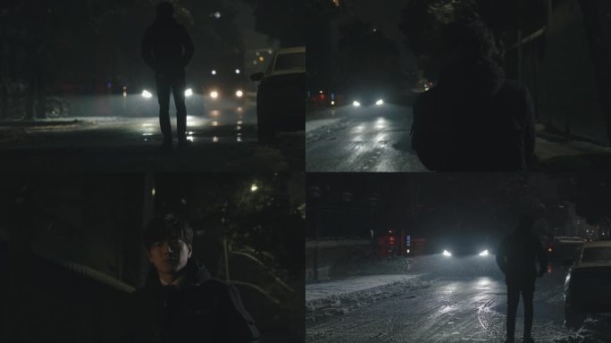 雪天夜晚：年轻人迷茫的在路上行走