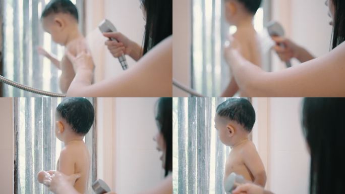 母亲按照早晨的惯例给儿子洗澡。