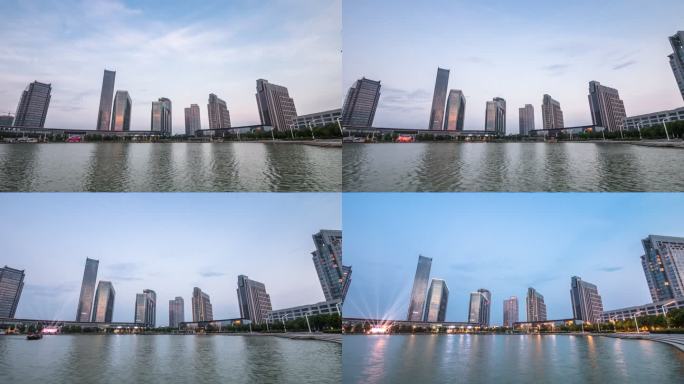 日落时分，现代城市中城区近水的现代建筑