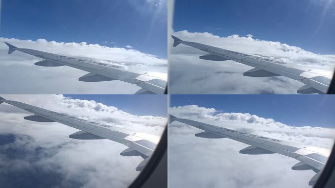 机舱内实拍飞机在云上飞行