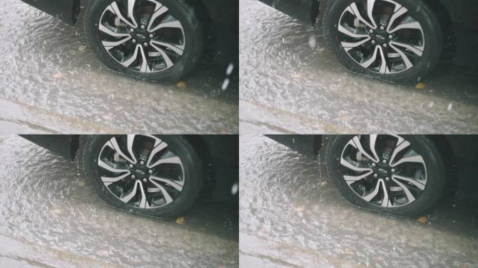 暴雨大雨车辆轮胎在水里