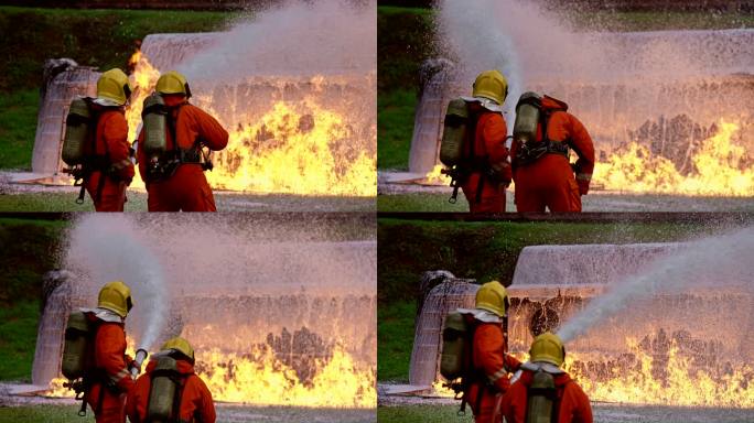 4kUHD消防员使用化学泡沫灭火器扑灭油罐车事故产生的火焰。消防安全灾难事故和公共服务理念。