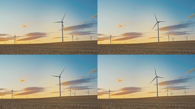SLO MO黄昏时在乡村旋转的风力涡轮机