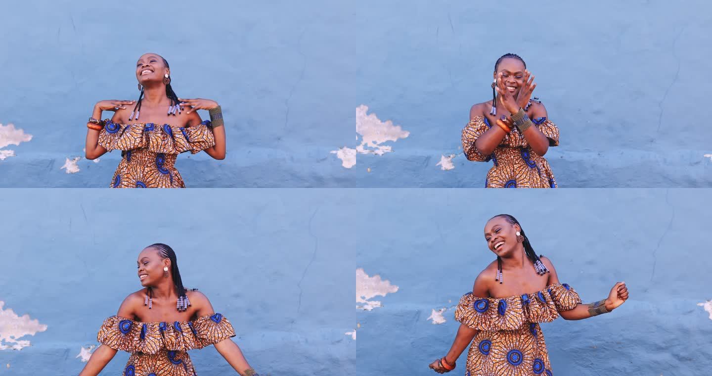 4k视频片段，一位迷人的年轻女子在城市的一堵蓝色墙壁上独自嬉戏跳舞