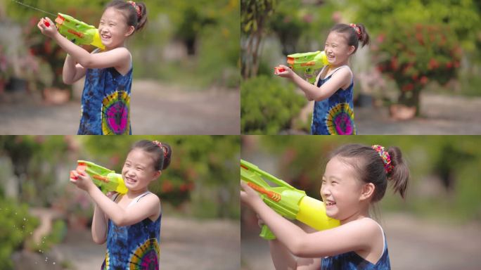 穿着泰国传统服装的孩子们在颂克兰节玩水枪