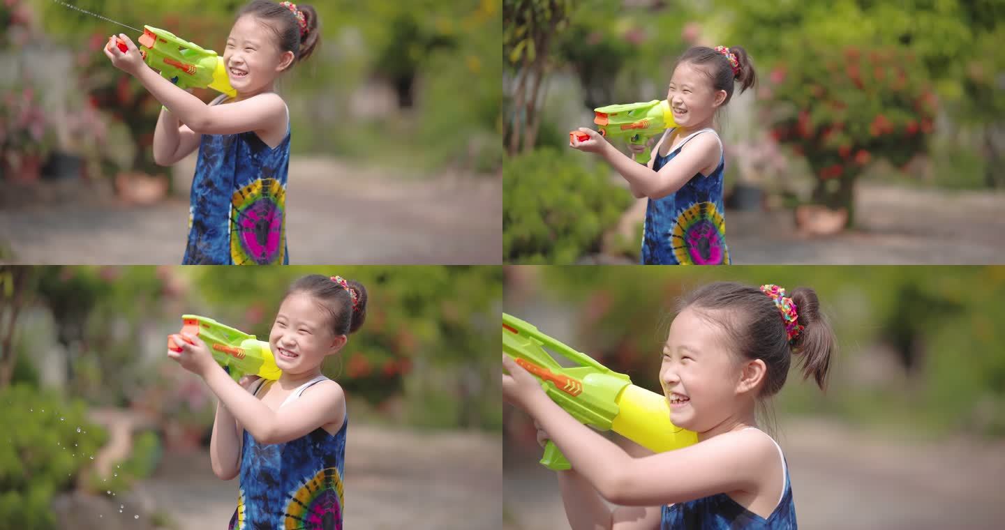 穿着泰国传统服装的孩子们在颂克兰节玩水枪