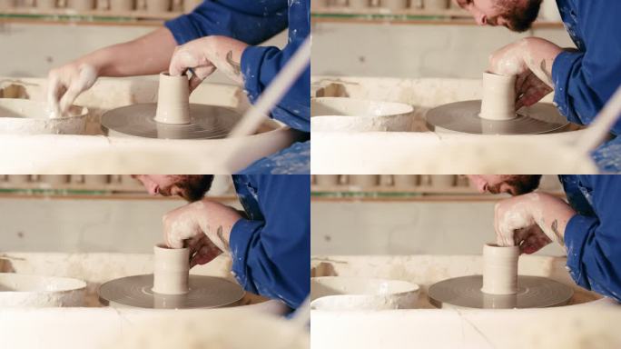 一个人的手在陶轮上模塑湿粘土。男性陶工在他的工作室里雕刻陶瓷艺术。技艺精湛的工匠，爱好爱好，制作手工