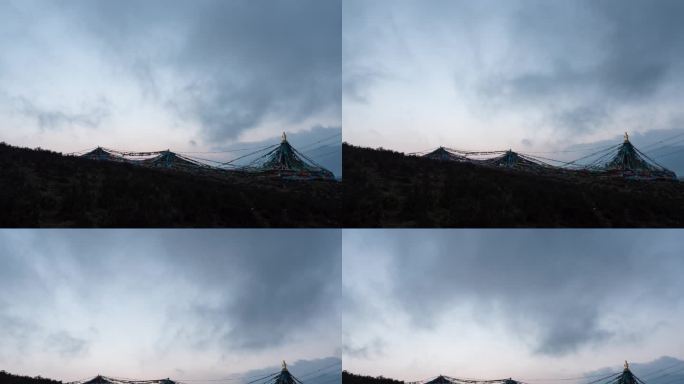 青海西藏的日落的经幡剪影