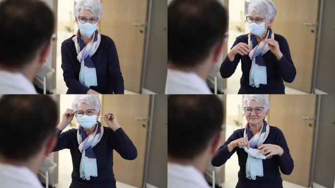 老年女性患者就诊老人看医生摘下口罩
