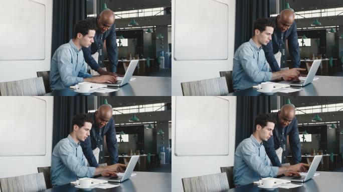两个商人在笔记本电脑上讨论一些事情。实习生向熟练的团队领导展示计算机演示。不同的同事一起使用应用程序