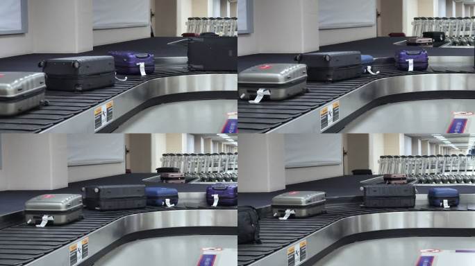 机场行李提取区转盘上移动的旅行包