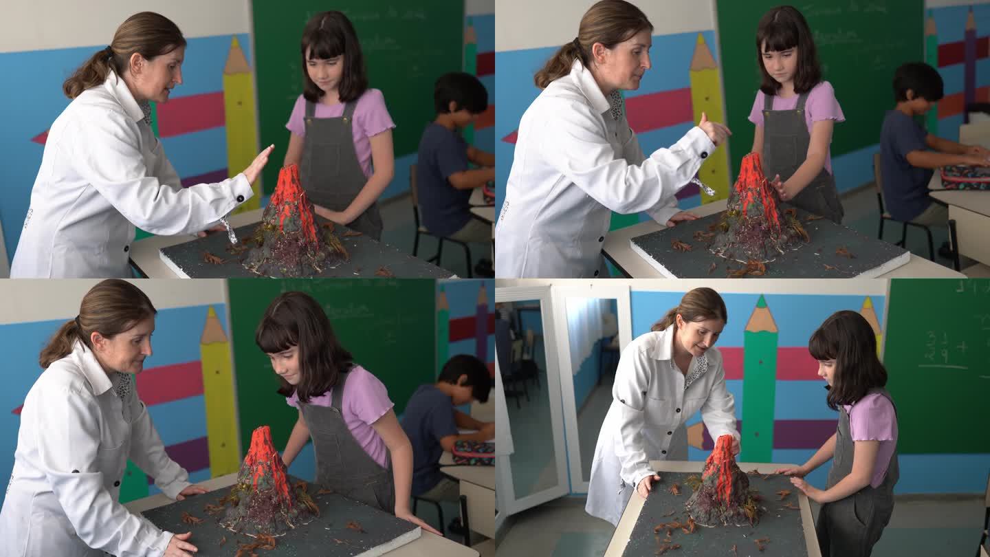 学生女孩和老师在教室里谈论火山