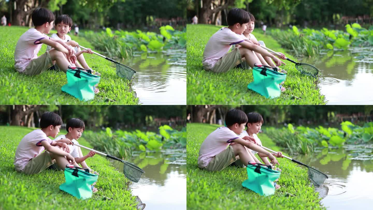带着渔网的男孩在河边