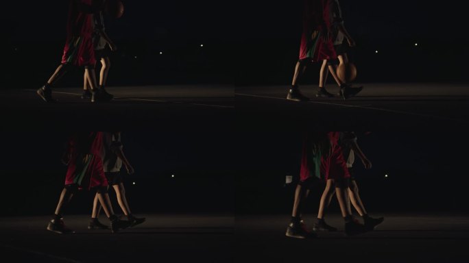 SLO MO篮球运动员晚上散步时弹球