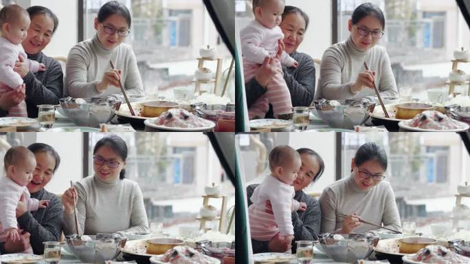 祖孙三代聚餐涮火锅小宝宝在奶奶怀里