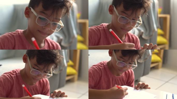 男孩在家画画孩子特长培养在纸上画东西认真