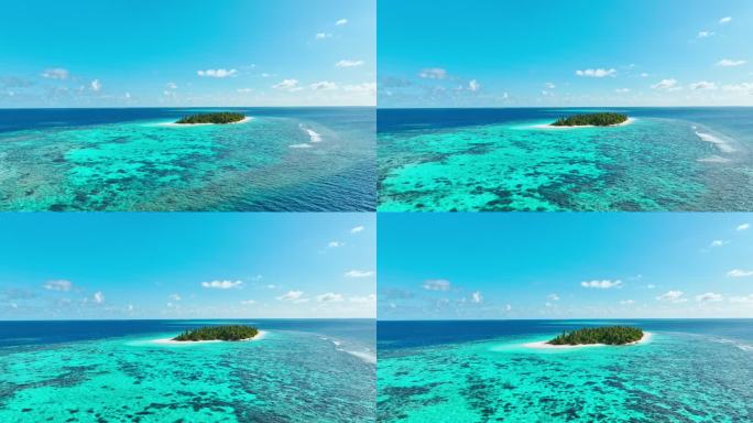 无人机飞越海洋和珊瑚礁上空的荒岛