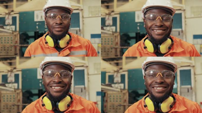 一位男性工程师的肖像在一家工厂里微笑。