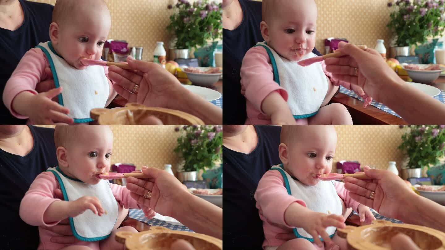 婴儿用婴儿汤匙吃婴儿粥。