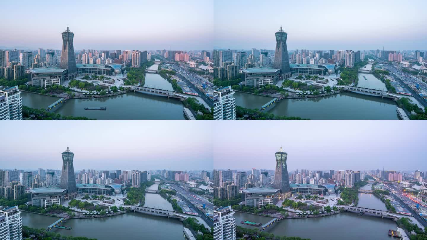 黄昏时分繁忙的河边交通与杭州市中心的现代建筑