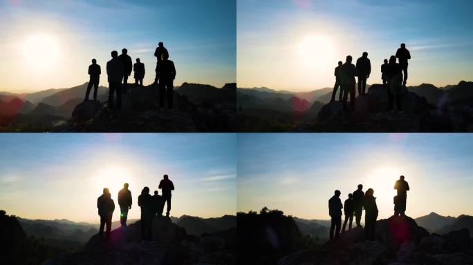 一群人登山山顶眺望远方人物逆光剪影看日落