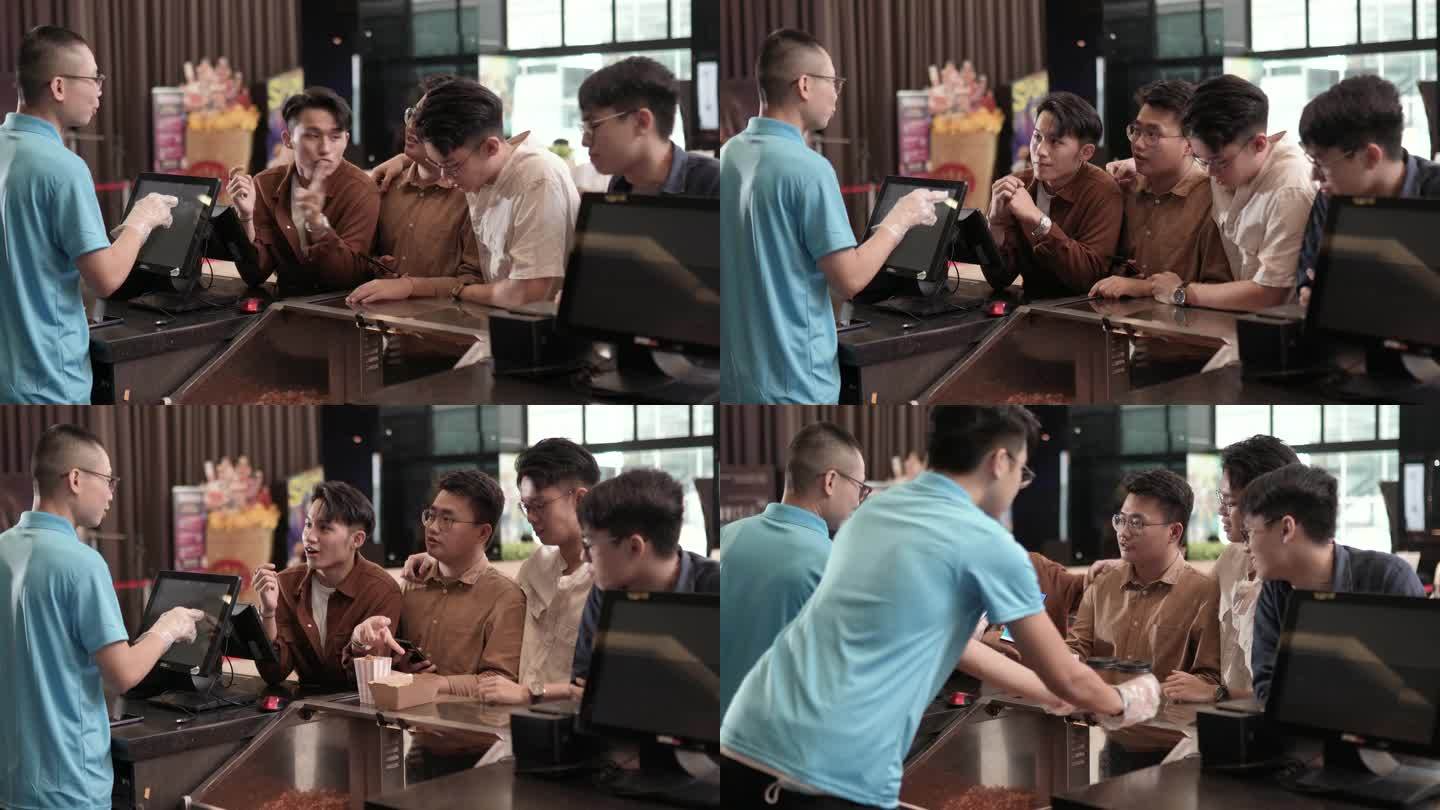 亚裔中国年轻男子在电影院电影放映时间前，在酒吧柜台用非接触式支付方式点了爆米花