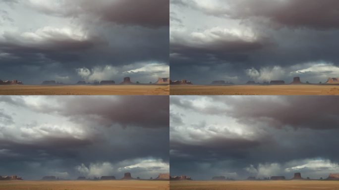亚利桑那州纳贾沃部落公园纪念碑谷的梅里克·巴特和米滕斯在戏剧性的天空和狂风沙尘暴下俯瞰超时空