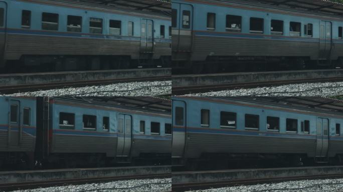 一列蓝色火车在火车站停下来的特写镜头。