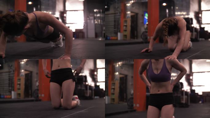 美女健身房锻炼身体做俯卧撑坚持性感肌肉