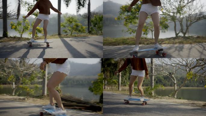 亚洲女性在美丽的夏日在户外冲浪或滑板。快乐的年轻女性在早上的时候在公园玩冲浪滑板。体育活动生活方式理