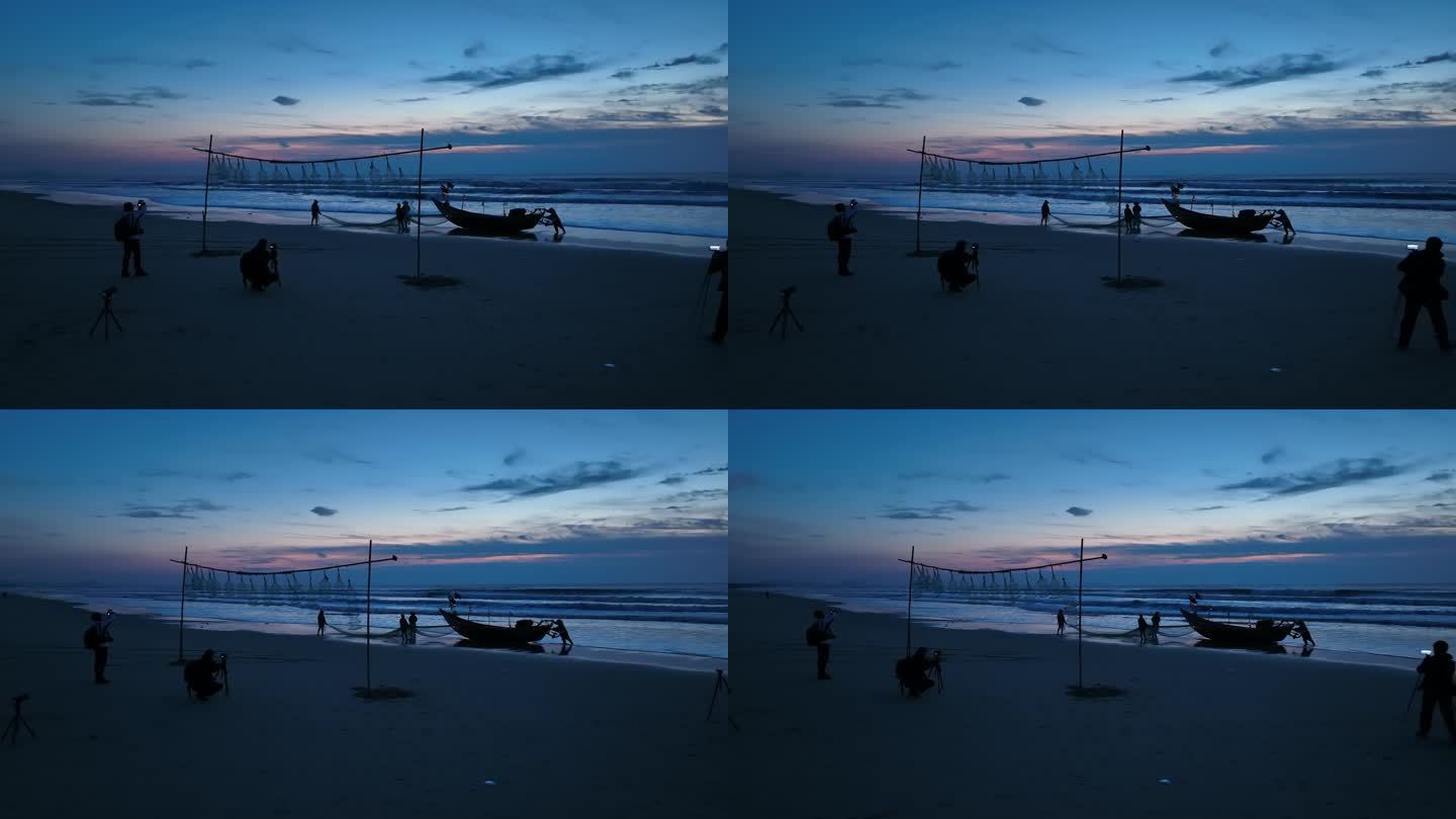 湛江吴川吴阳金海岸清晨在海边拍摄的人