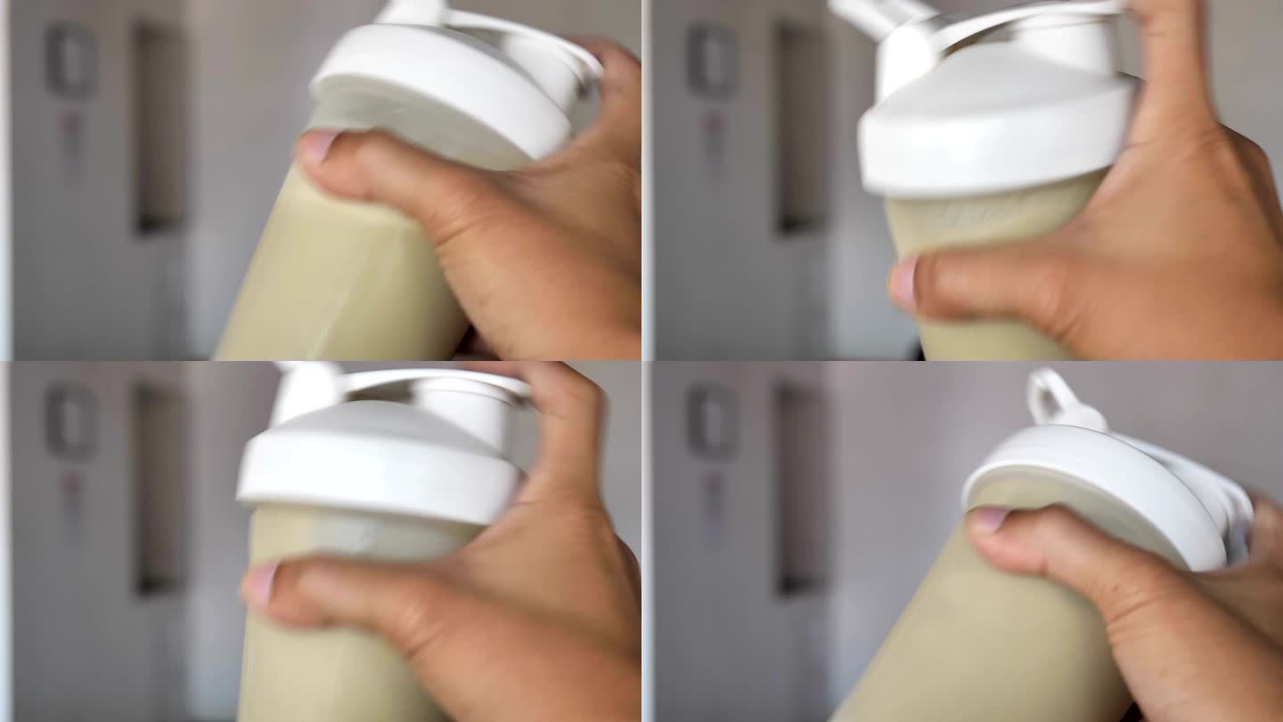 减肥奶昔粉在摇瓶中与水混合。