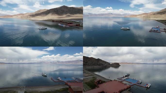 航拍西藏班公湖湖面游船大景环绕画面