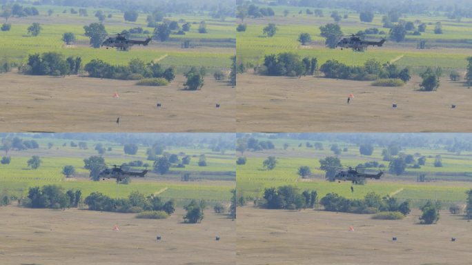 军用直升机在空中飞行。