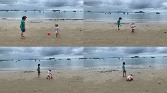 兄弟姐妹在海滩上玩球