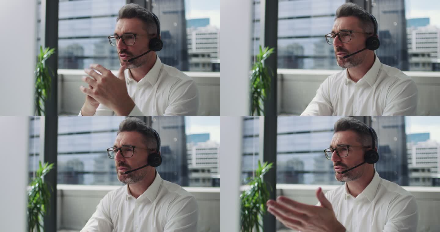 一位成熟商人在现代办公室使用耳机和电脑的4k视频片段