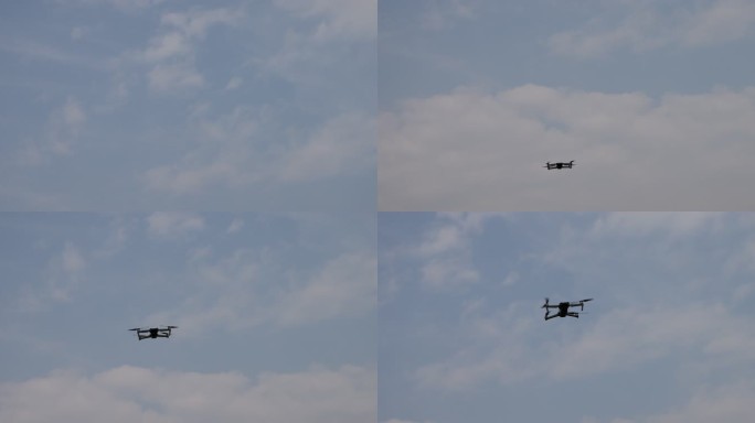 蓝天白云下飞行的无人机