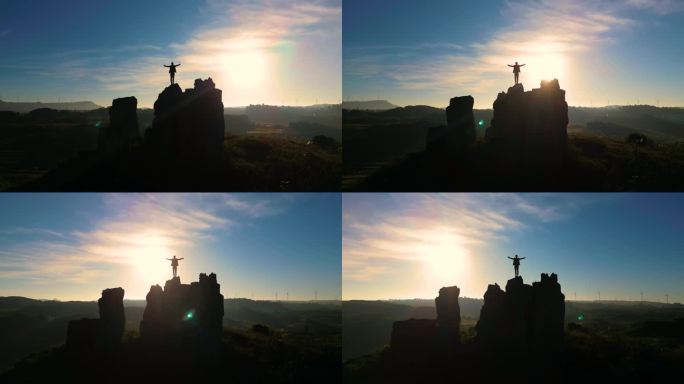 登山成功张开双臂拥抱太阳希望曙光人生旅途