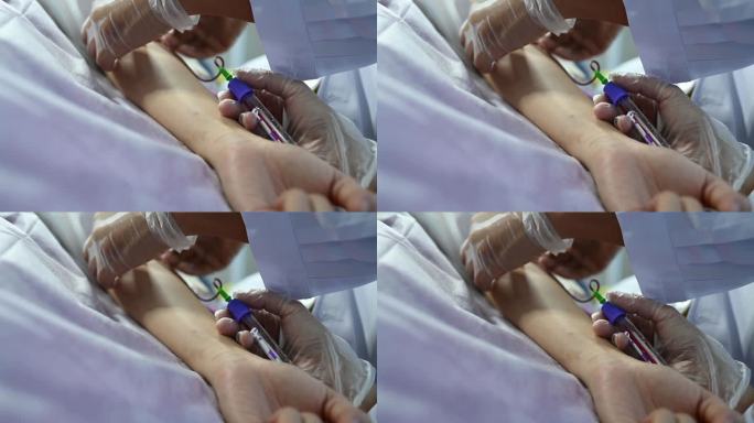 亚裔华裔女医生护士从年轻女性身上采集血样