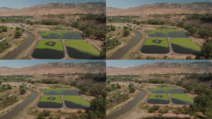 夏季无人机查看科罗拉多河流域农业绿地和水处理以及BookCliff山脉4K视频系列