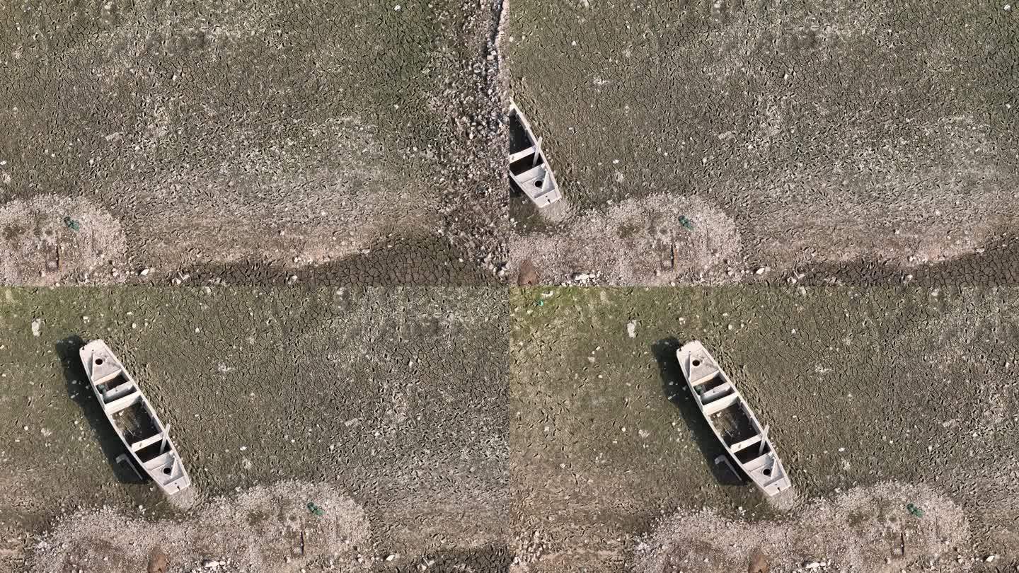 干旱枯水期河道湖底河床废弃小木船荒凉实拍