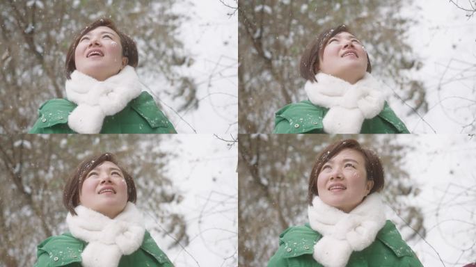 在雪中玩耍的女人微笑下雪好心情