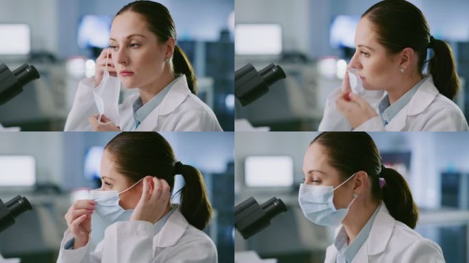 女科学家戴着口罩，看着显微镜。Covid19研究人员正在研究生物体。白人技术人员在实验室分析样本。