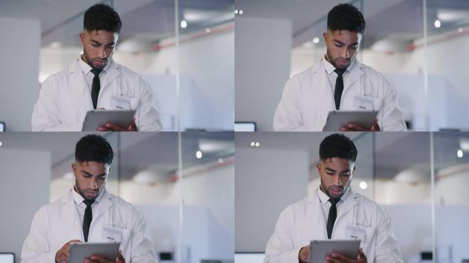 科学家在实验室里使用平板电脑，西班牙裔男性技术人员在平板电脑上打字。Covid19研究人员在实验室内