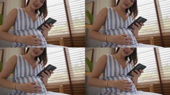 亚洲孕妇在家使用手机