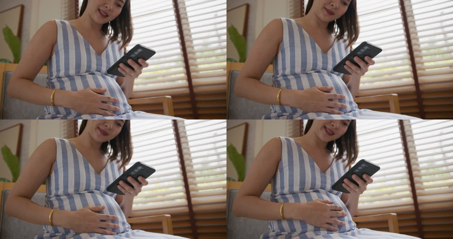 亚洲孕妇在家使用手机