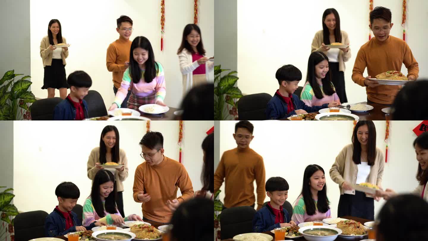 快乐的亚裔华人家庭准备迎接中国新年团圆晚餐