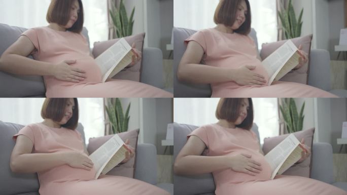 怀孕的亚洲妇女与婴儿一起看书休息时间