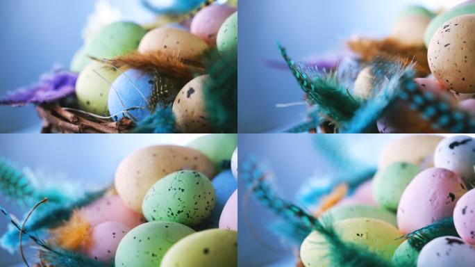 复活节彩蛋放在一个鸟巢里，羽毛颜色鲜艳，背景是蓝色的木头