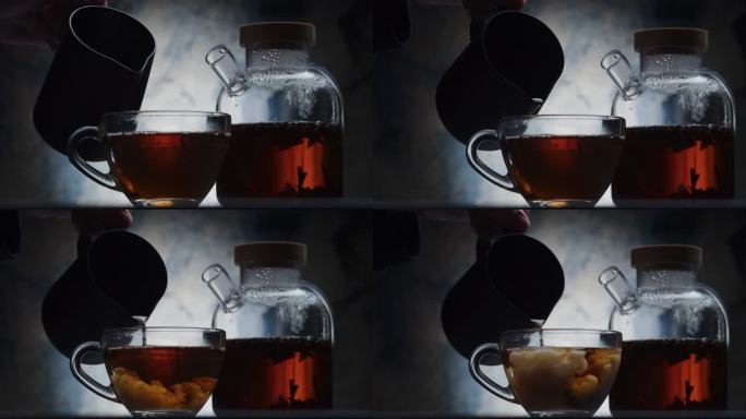 在茶杯中加入牛奶泡茶饮茶红茶茶道文化